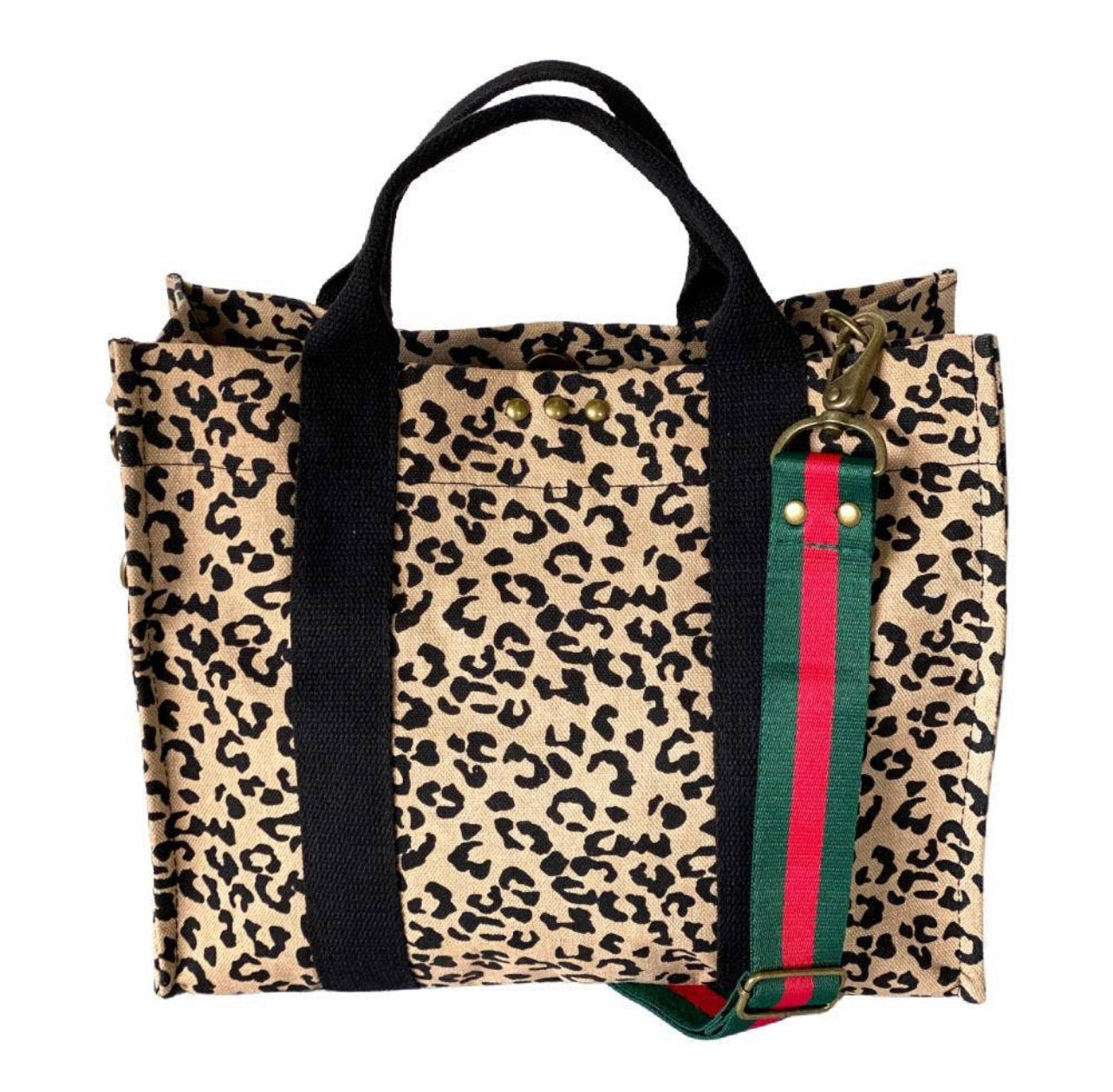 Our new PS canvas totes are the perfect size for everyday use. They are the perfect accessory to top off any outfit! Material: Cotton Canvas. Measure: 10 inches x 12.25 inches x 6 inches. The removable strap, measures 1.5 inches wide, extending to 40 inches. Each bag has a magnetic closure, and one small inside pocket.