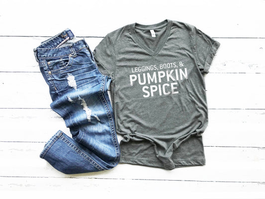 Leggings, Boots, and Pumpkin Spice Tee. This updated unisex tee essential fits like a well-loved favorite, featuring a classic V-neck, short sleeves and superior combed and ring-spun cotton. JLD is super excited to customize your new fall tee!   Choose your shirt size, color, and your art color to make this perfect fall tee your own! 