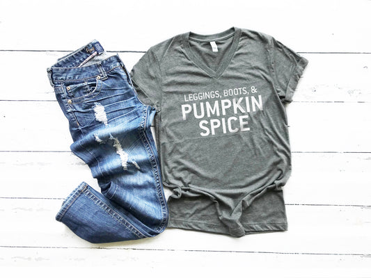 Leggings, Boots, and Pumpkin Spice Tee. This updated unisex tee essential fits like a well-loved favorite, featuring a classic V-neck, short sleeves and superior combed and ring-spun cotton. JLD is super excited to customize your new fall tee!   Choose your shirt size, color, and your art color to make this perfect fall tee your own! 