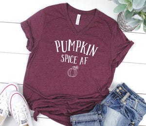 Pumpkin Spice AF Tee. This updated unisex tee essential fits like a well-loved favorite, featuring a classic V-neck, short sleeves and superior combed and ring-spun cotton. JLD is super excited to customize your new fall tee!   Choose your shirt size, color, and your art color to make this perfect fall tee your own! 